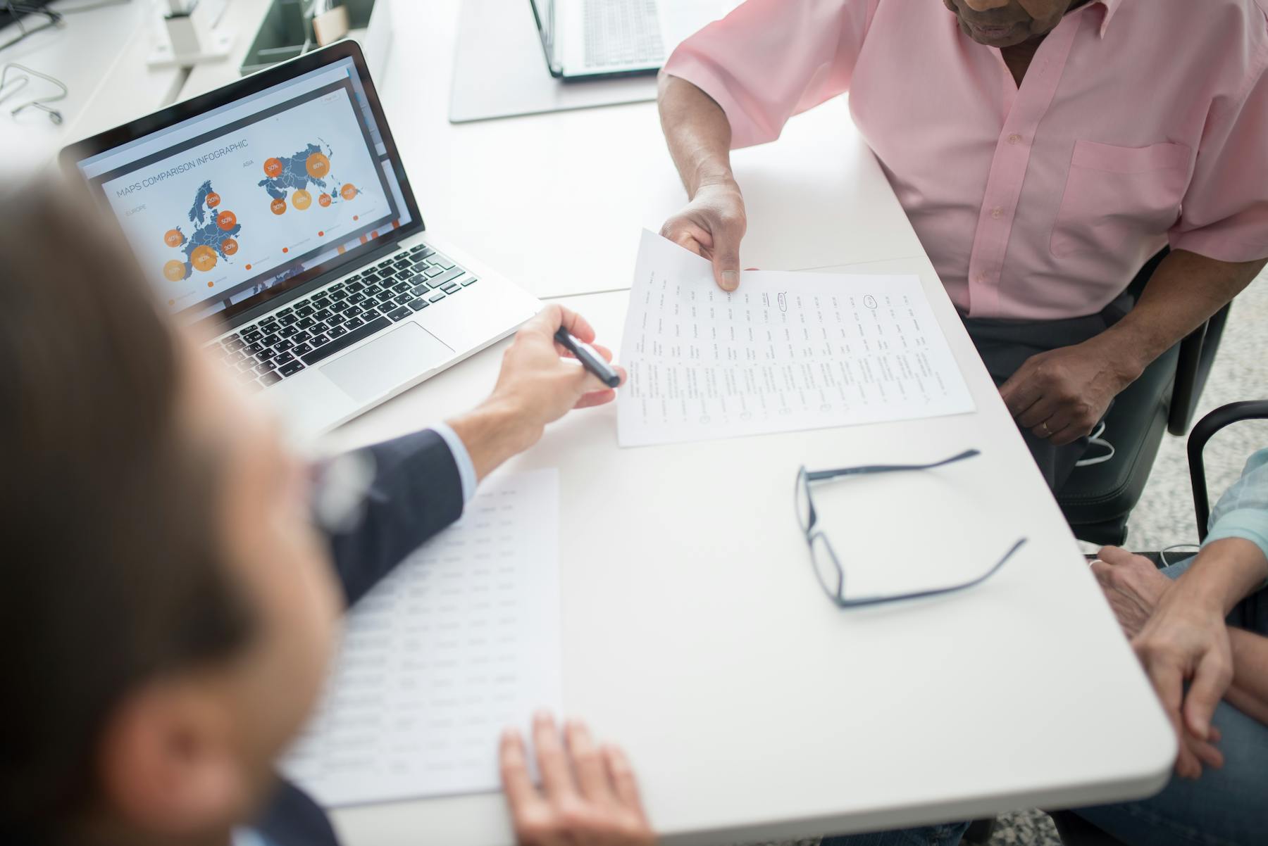 An insurance advisor meeting with a family